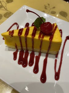 Order Mango Mousse Cake food online from Present Restaurant store, Falls Church on bringmethat.com