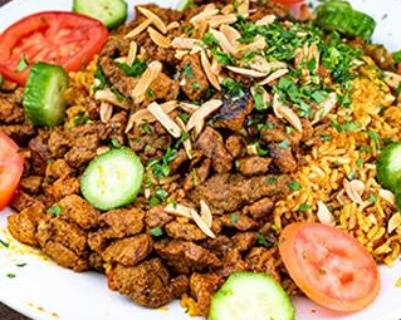 Order Lamb Biryani with roasted nuts food online from Aladdin Cafe store, San Diego on bringmethat.com