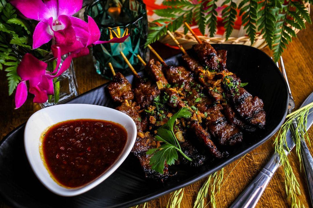 Order SB4. ‘MARANGGI’ BEEF SATÉ food online from Win Indonesian Grill & Gastrobar store, Atlanta on bringmethat.com