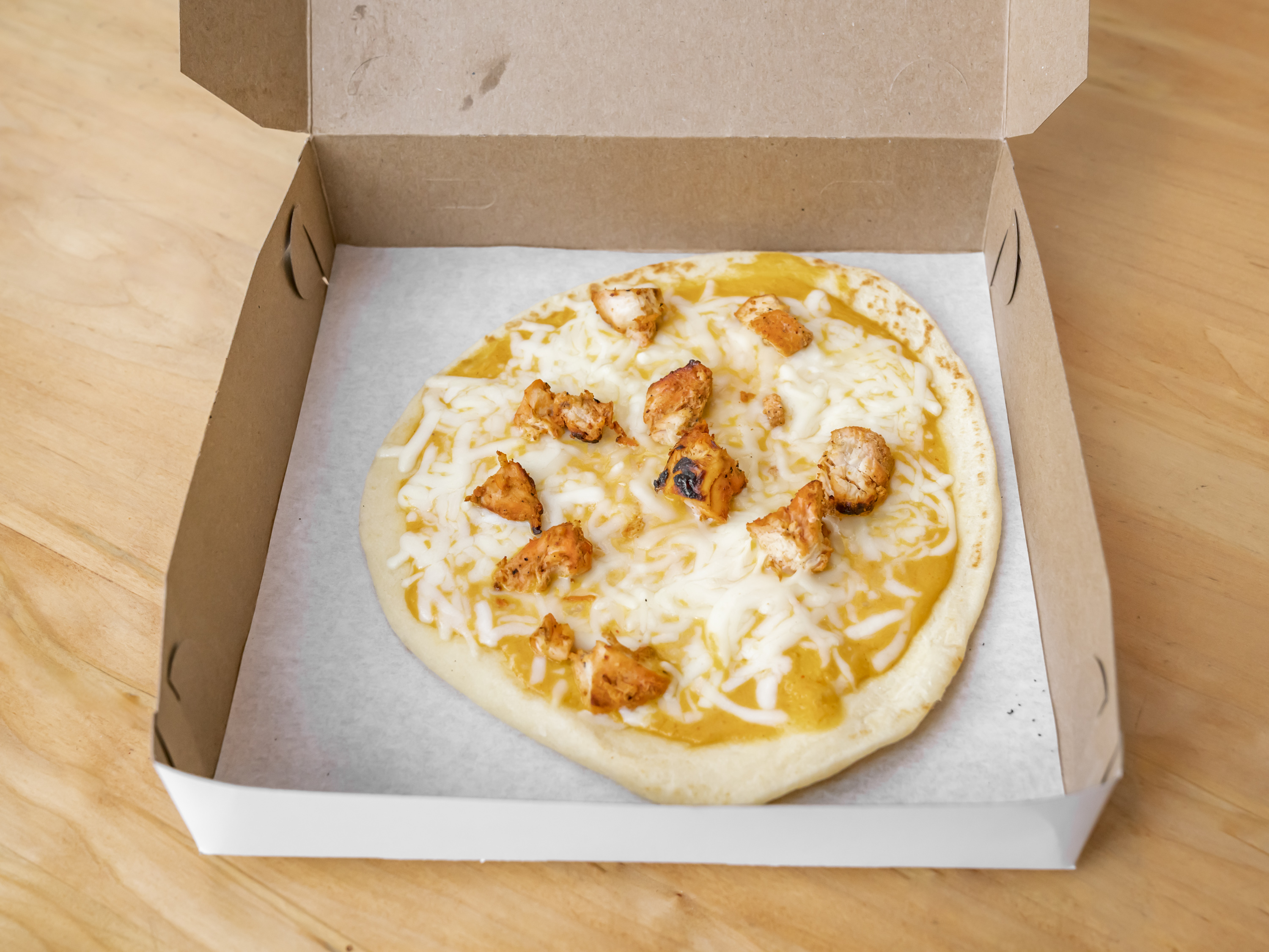 Order Naan Pizza food online from Bombay Burrito store, Willoughby on bringmethat.com