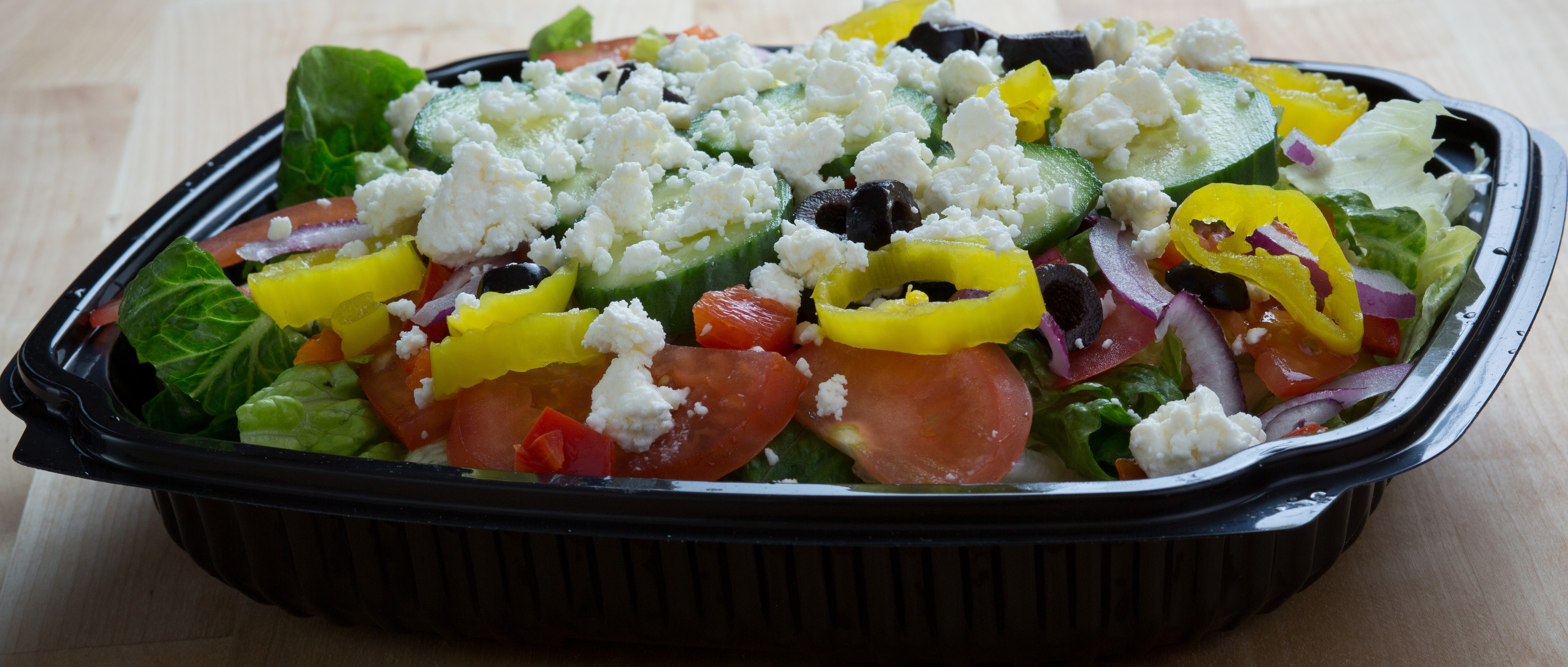 Order Greek Salad food online from Pizza Pit Extreme store, Iowa City on bringmethat.com