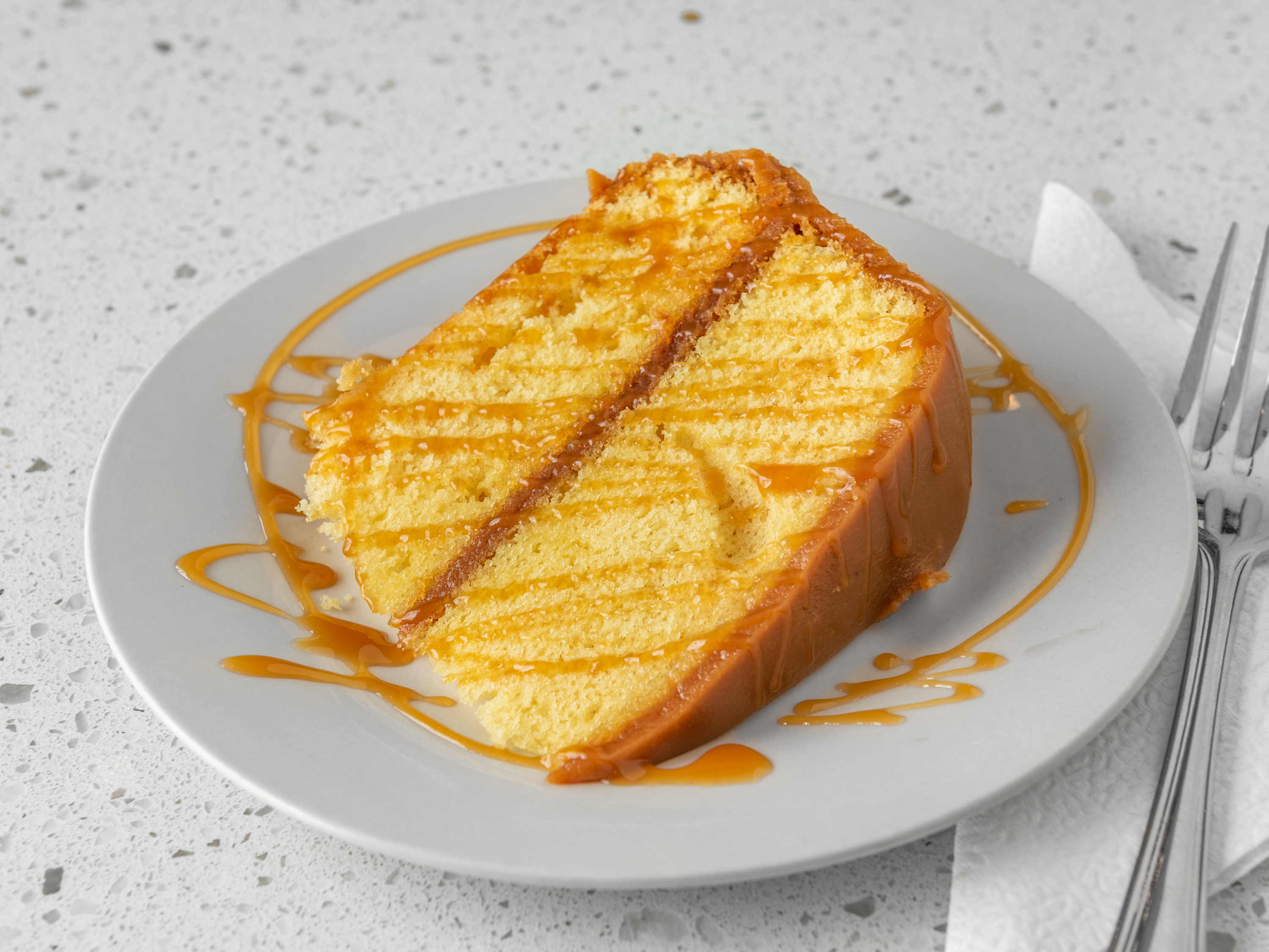 Order Carmel Cake food online from Aunty Joy's Jamaican Kitchen store, Chicago on bringmethat.com