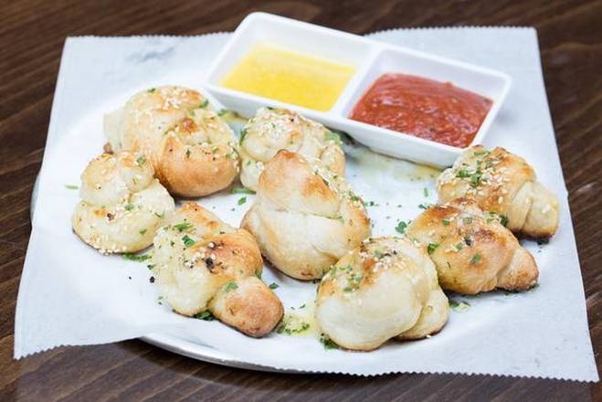 Order Garlic Knots (not available in gluten-free) food online from The Couch Tomato Cafe store, Philadelphia on bringmethat.com