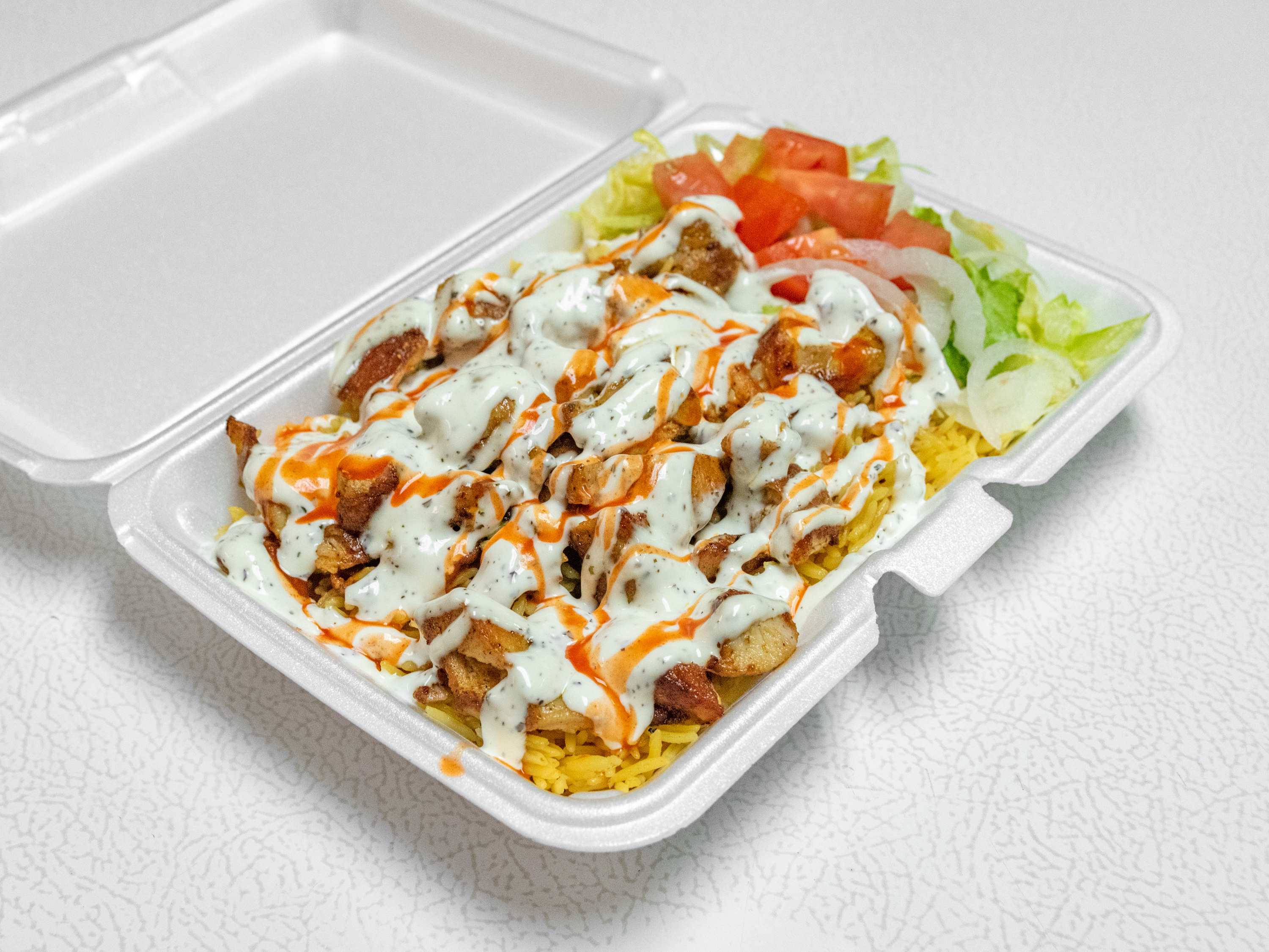 Order Chicken Over Rice  food online from Halal Crown Fried Chicken store, Wilkes-Barre on bringmethat.com