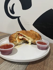 Order Pepperoni & Cheese Calzones food online from Grumpyz Pizza & Deli store, Phillipi on bringmethat.com