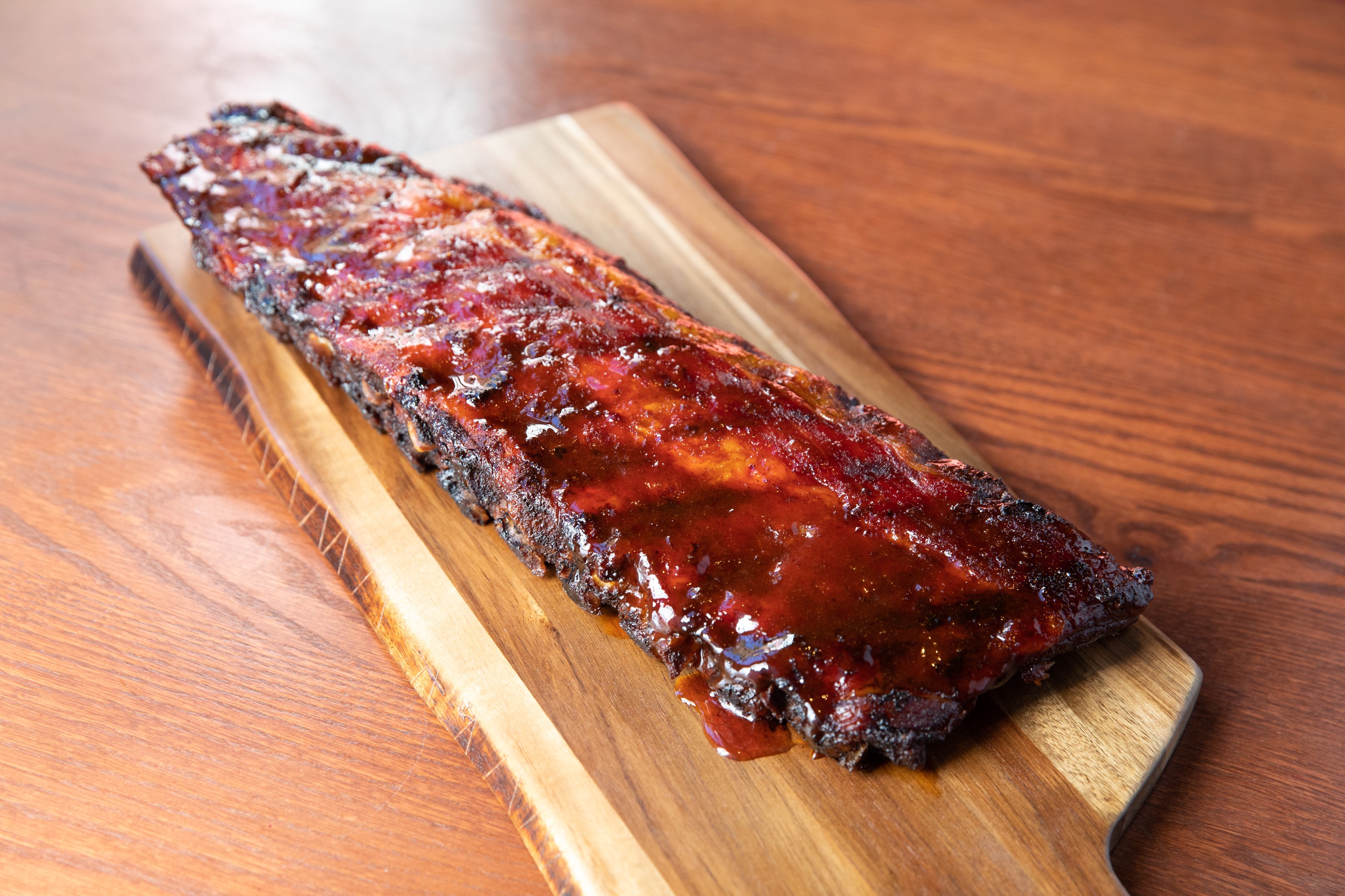 Order Smoked Baby Back Ribs food online from Smokey Bones Barbeque and Grill store, Mentor on bringmethat.com