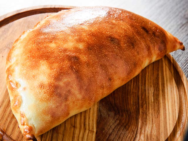 Order Meat Lover Calzone food online from Napoli's Pizza store, Virginia Beach on bringmethat.com