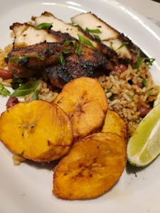 Order Jerk Chicken & Jamaican Rice food online from Rhapsody store, Fresno on bringmethat.com