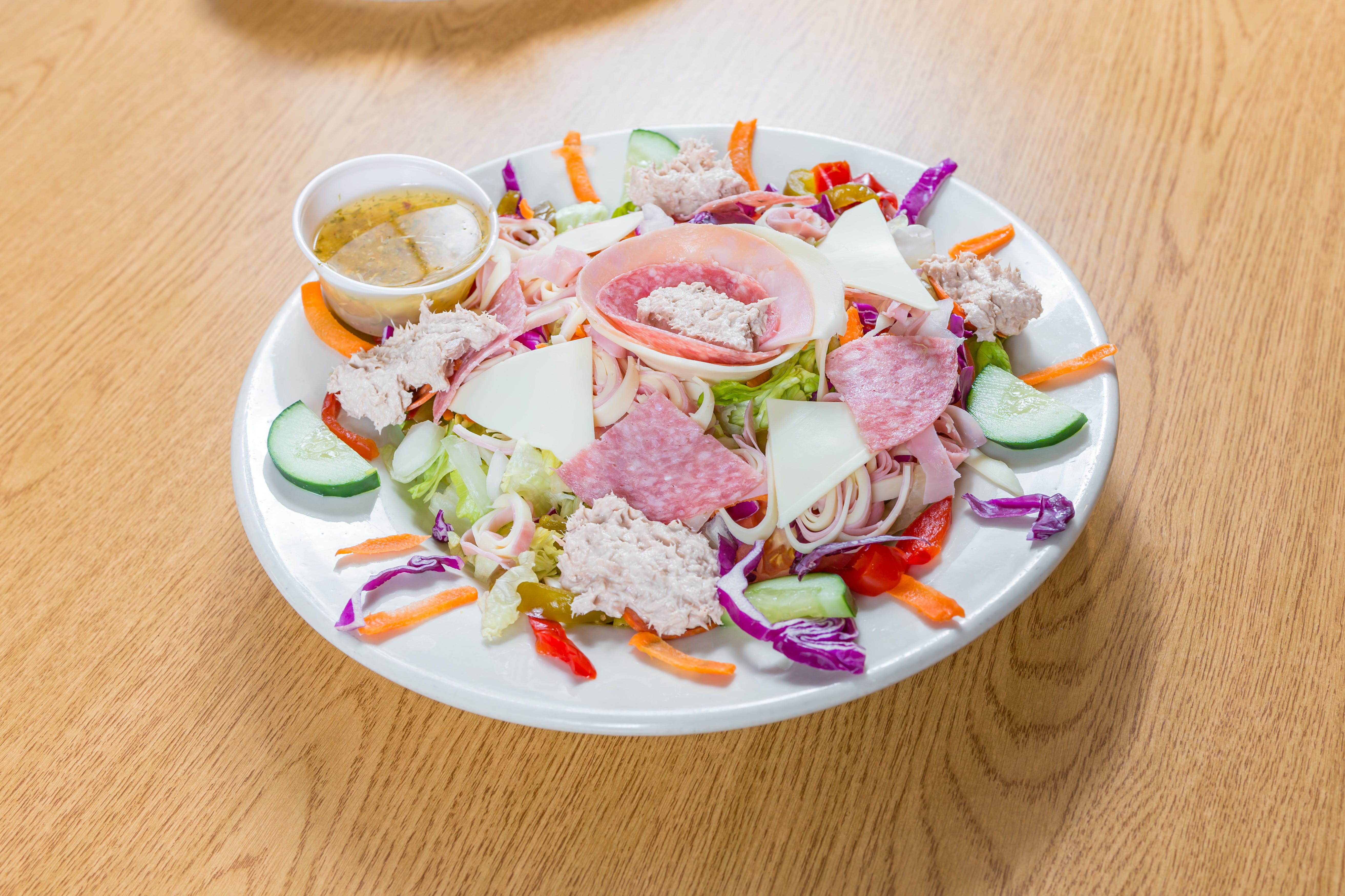 Order Antipasto Italiano Salad - Salad food online from Andre's Pizza store, Oxford on bringmethat.com