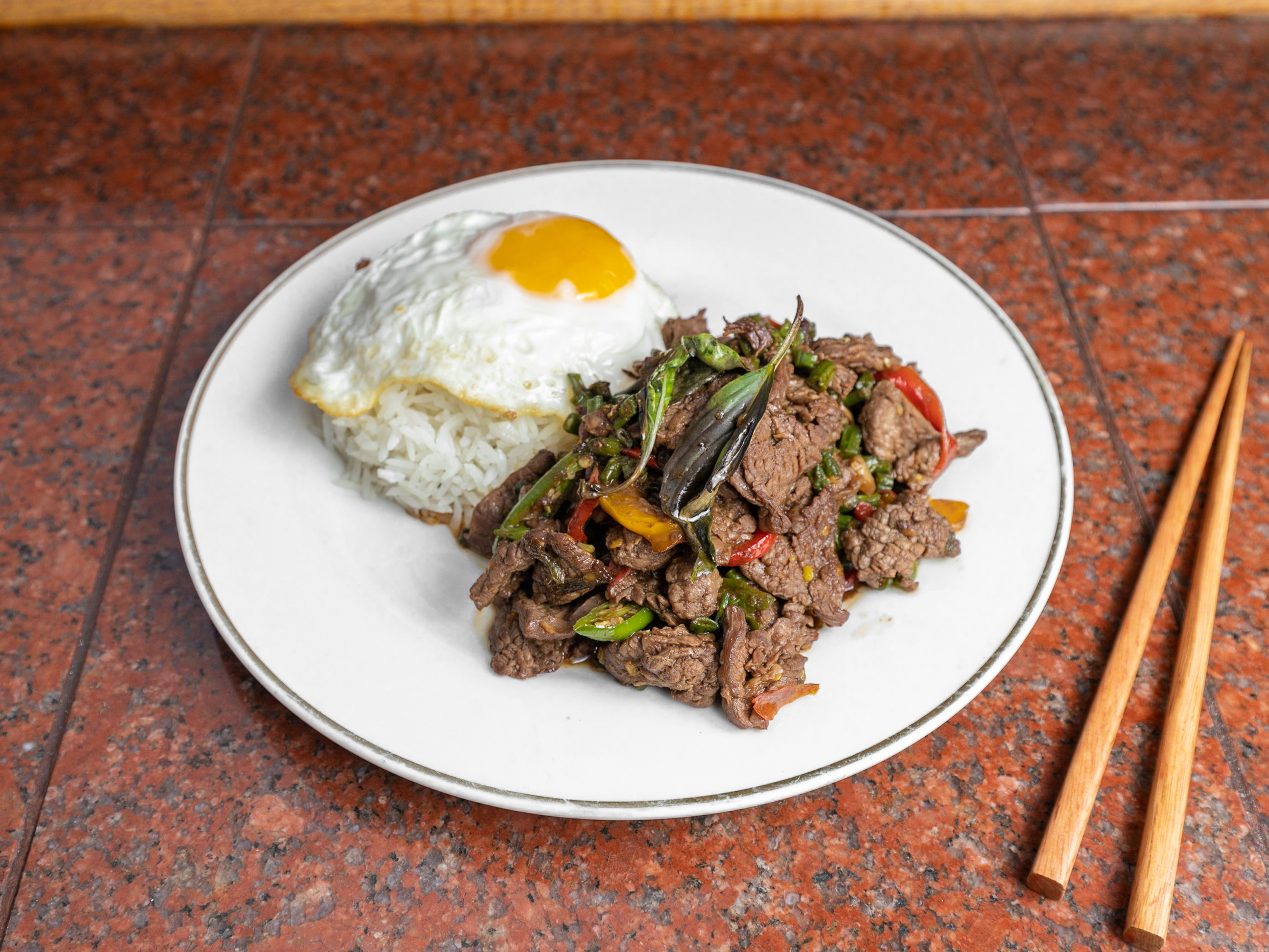 Order Basil beef over rice + Fried egg food online from Thai Power Restaurant store, Daly City on bringmethat.com