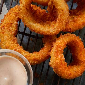 Order Jumbo Cajun-Seasoned Onion Rings food online from Conviction Chicken and Wings store, West Covina on bringmethat.com