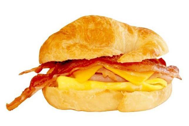 Order #87 Ham, Bacon, Egg, and Cheese on Croissant food online from Lee Sandwiches store, Hawaiian Gardens on bringmethat.com