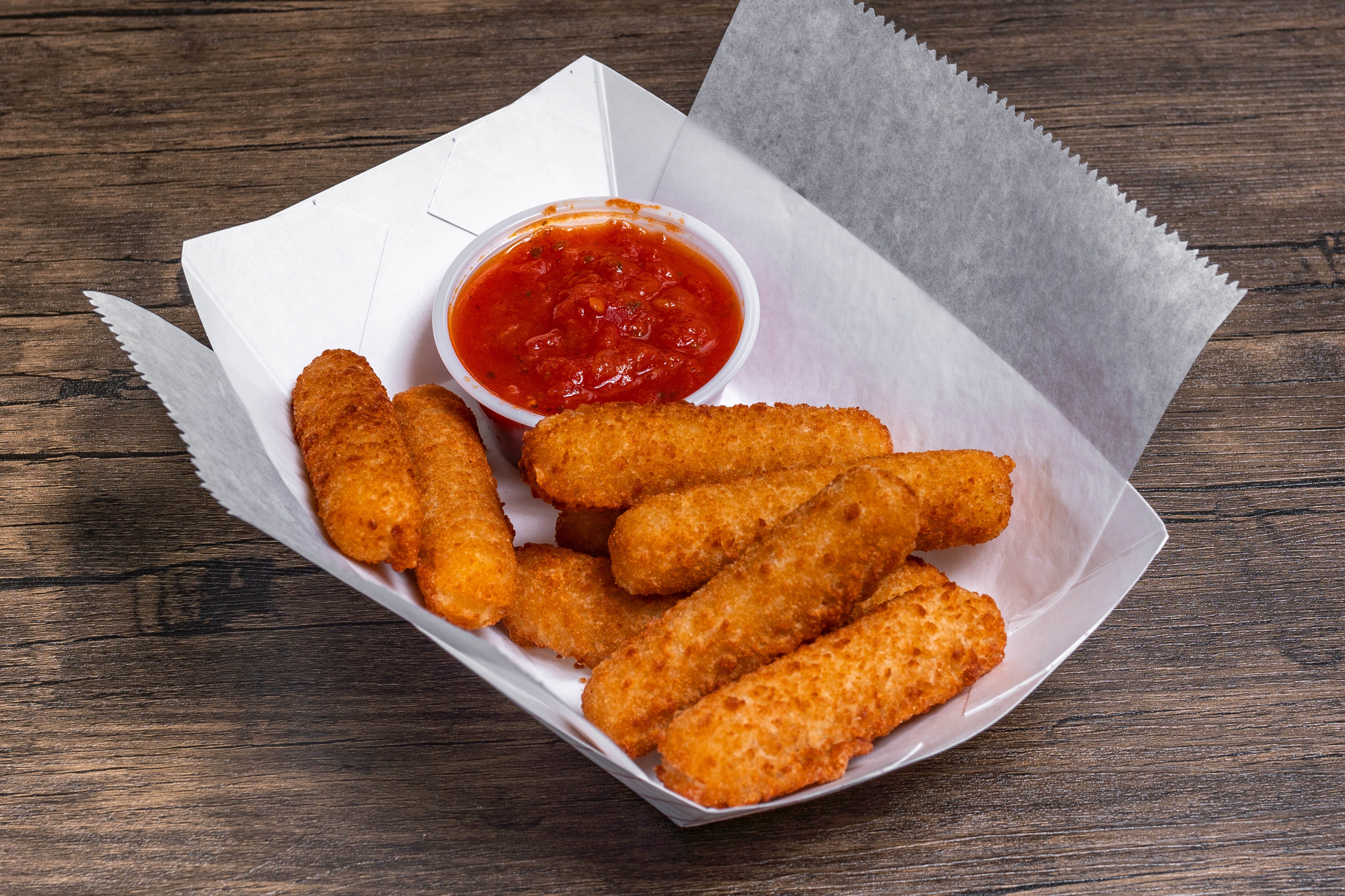 Order Mozzarella Sticks with Sauce - 8 Pieces food online from Milano Pizza store, Frankston on bringmethat.com