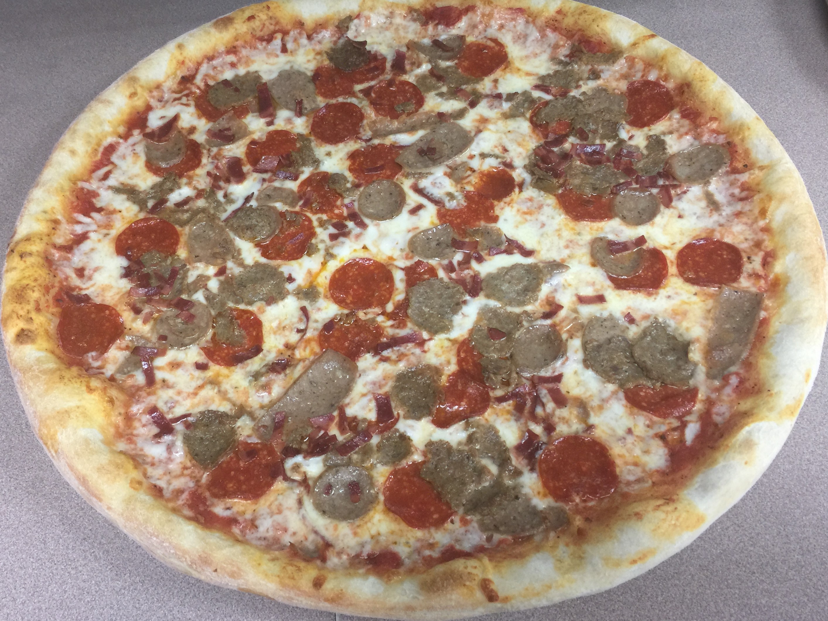 Order Meat Lover's Pizza food online from Divano Pizza store, Garner on bringmethat.com
