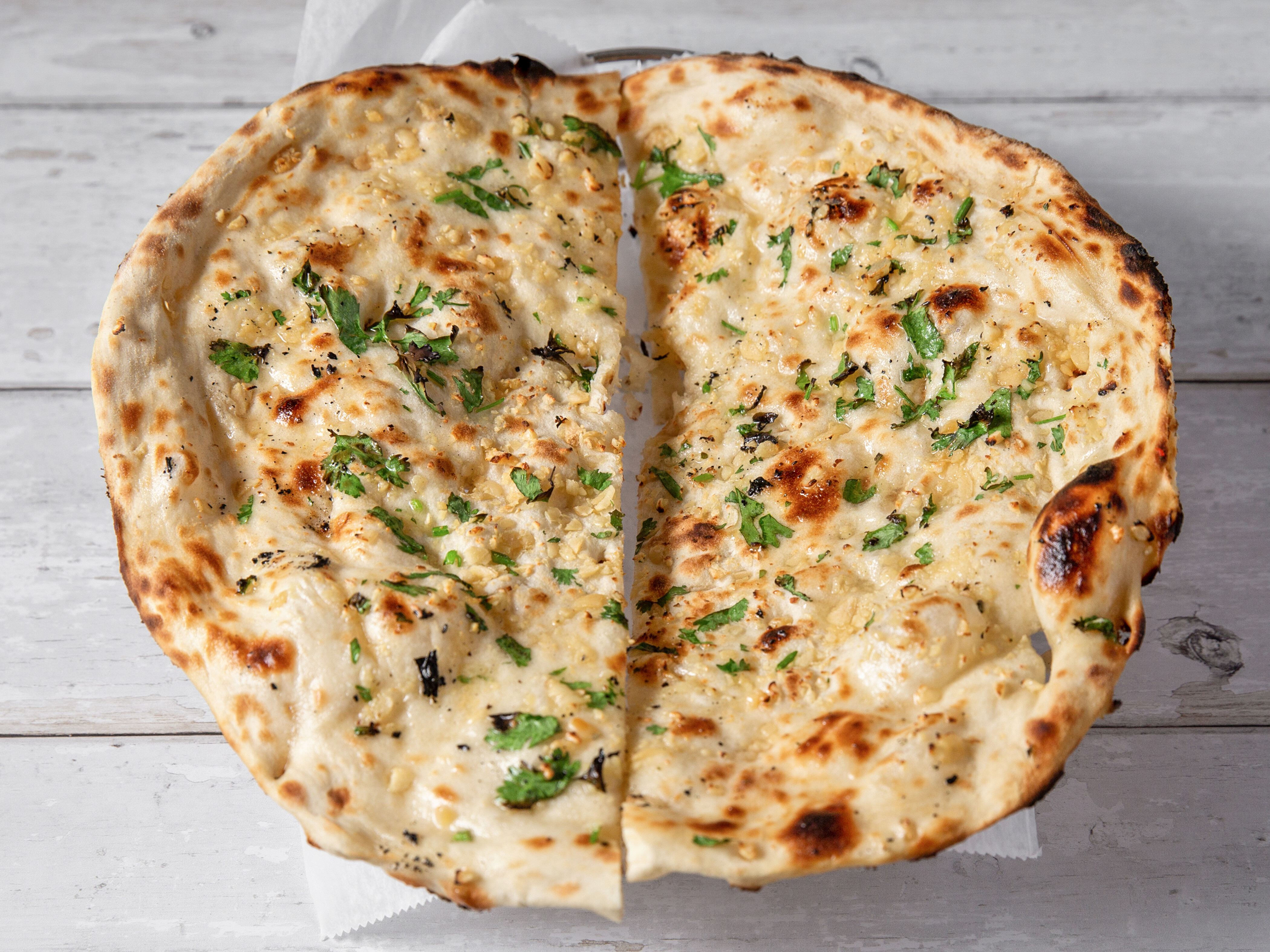 Order Garlic Naan food online from The Clay Oven Indian Restaurant store, Roxbury Township on bringmethat.com