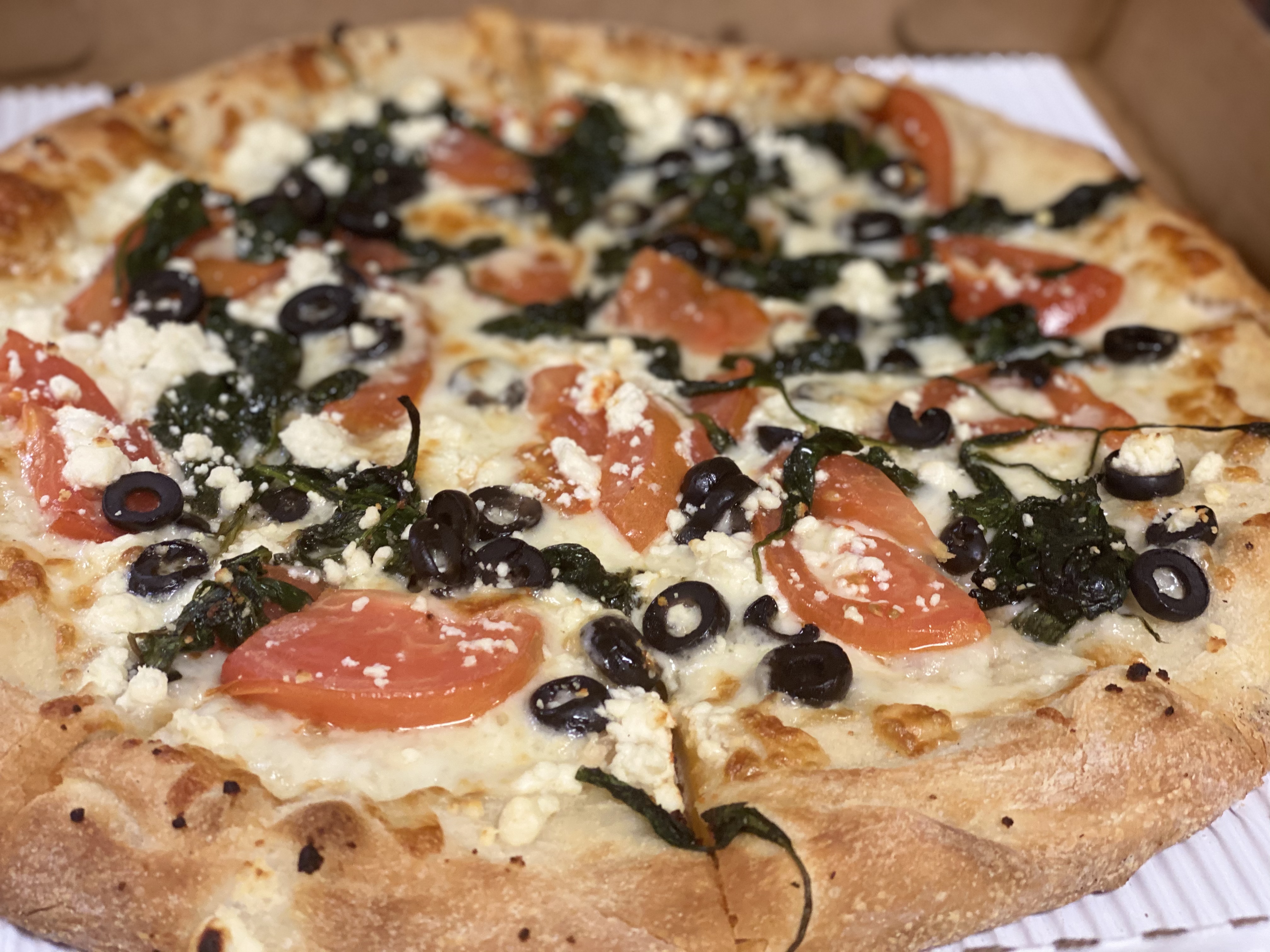 Order Greek Pizza food online from Rosario's store, Philadelphia on bringmethat.com