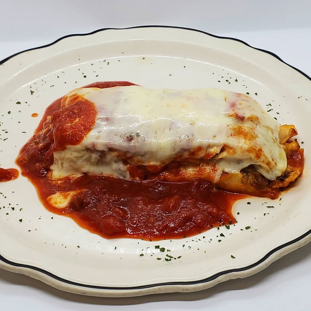 Order Lasagna with Meat - Entree food online from Bella Italia Ristorante & Pizzeria store, Newton on bringmethat.com