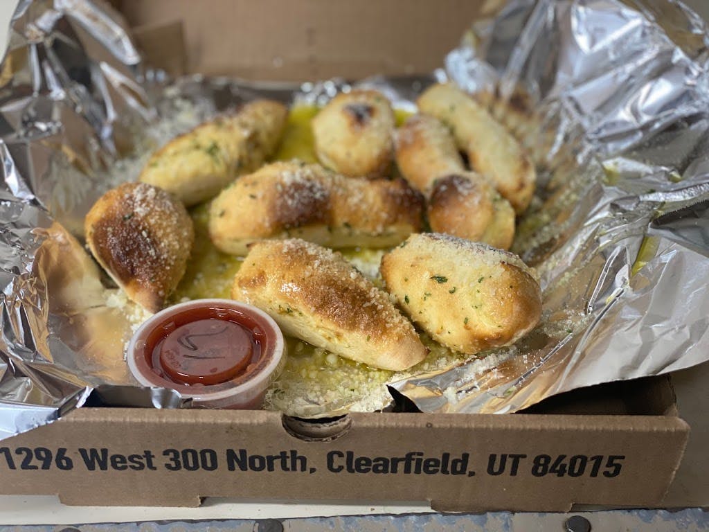 Order Garlic Bites - 8 Pieces food online from Ritas Pizzeria store, Clearfield on bringmethat.com