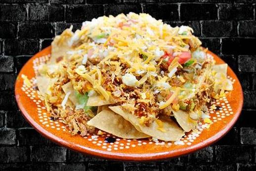 Order Carnitas Nachos food online from RIVAS MEXICAN GRILL store, Fort Mohave on bringmethat.com