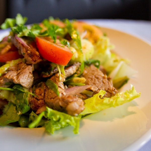 Order Yum Nuea Salad food online from Bai Tong Thai Restaurant store, Issaquah on bringmethat.com