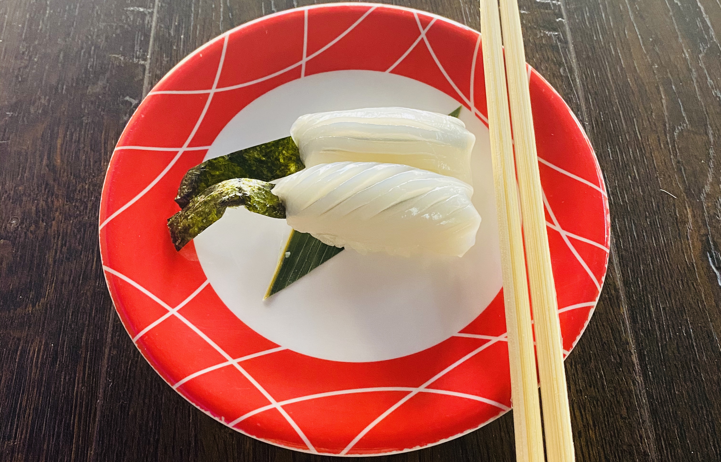 Order Ika Nigiri - 2 pieces food online from Sushi Train store, Minneapolis on bringmethat.com