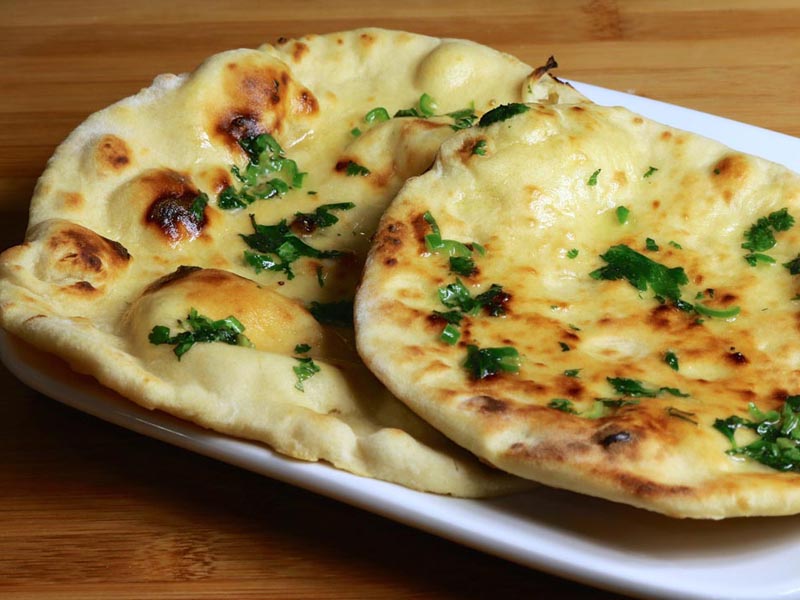Order Plain Naan food online from Curries store, Everett on bringmethat.com