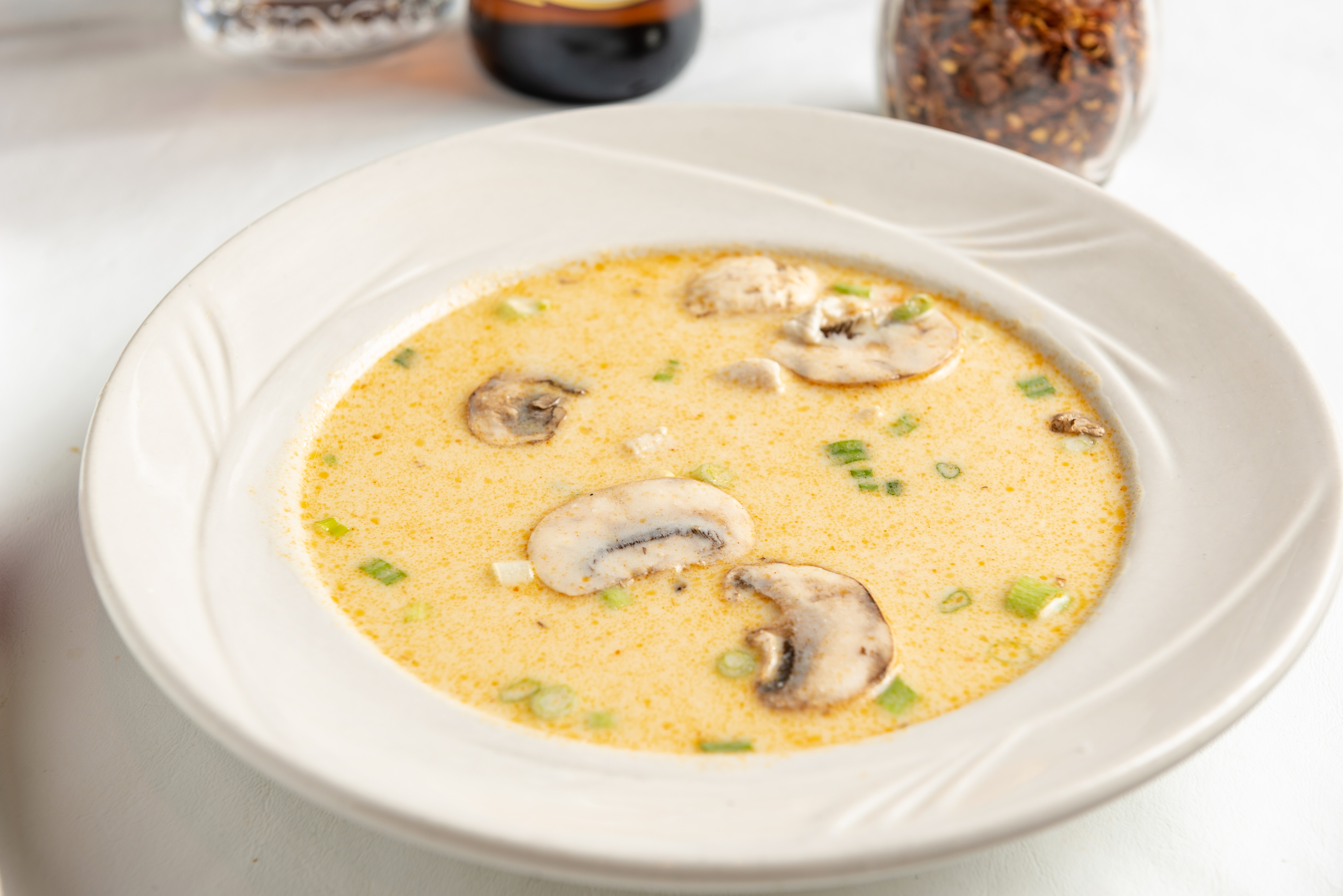 Order Tom Kha Spicy Coconut Soup food online from Phuket Thai Restaurant and Sushi store, Huntsville on bringmethat.com
