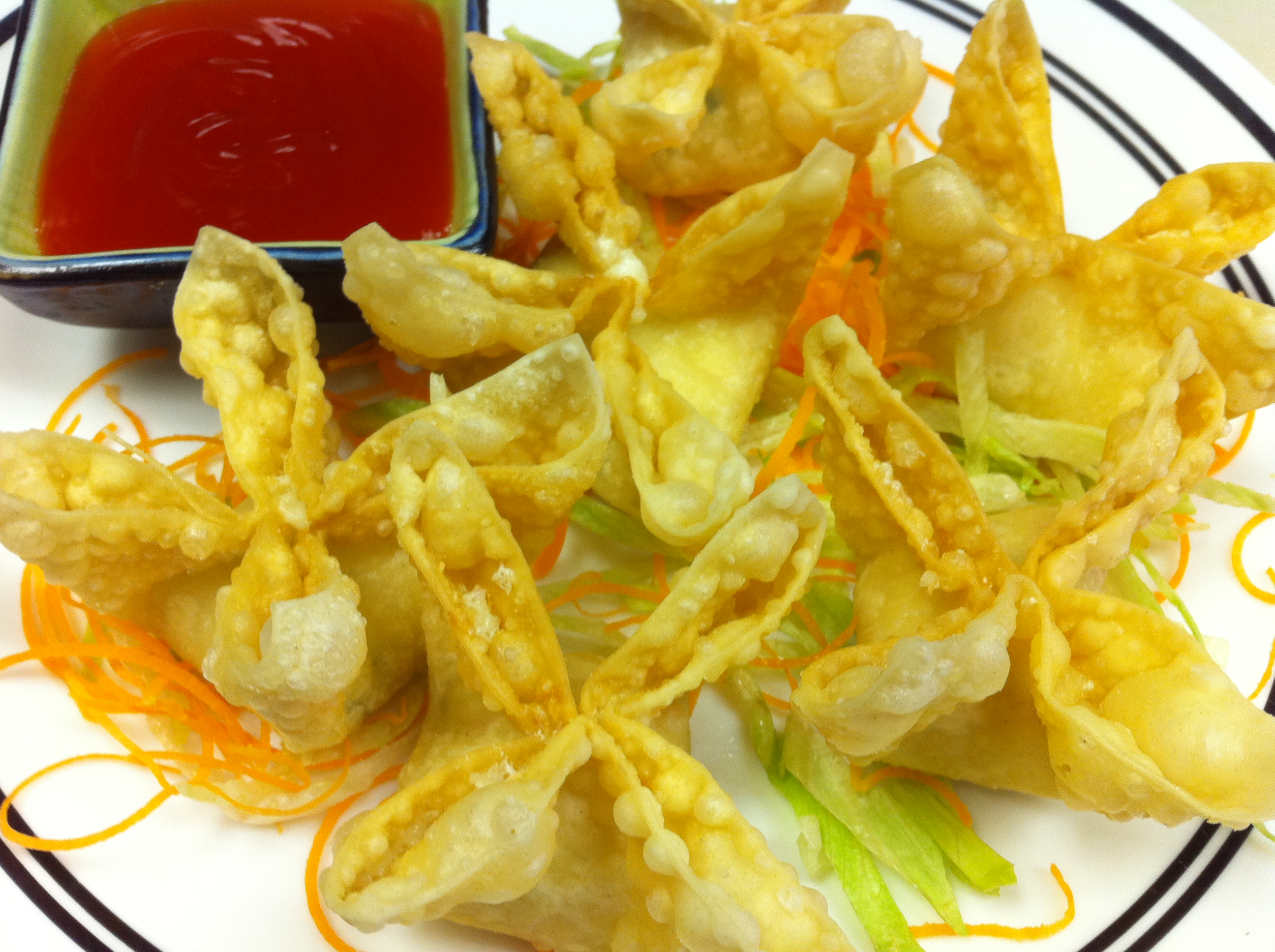 Order Crabmeat Rangoon food online from Tintin Cafe store, Charlotte on bringmethat.com