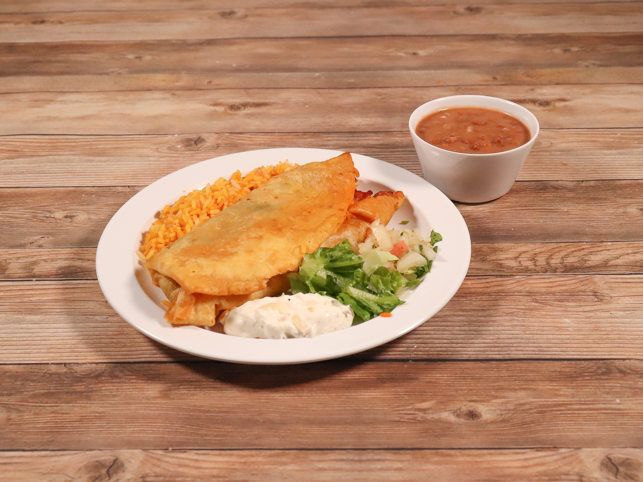 Order Chicken Chimichanga food online from El Aguila Restaurant store, Silver Spring on bringmethat.com