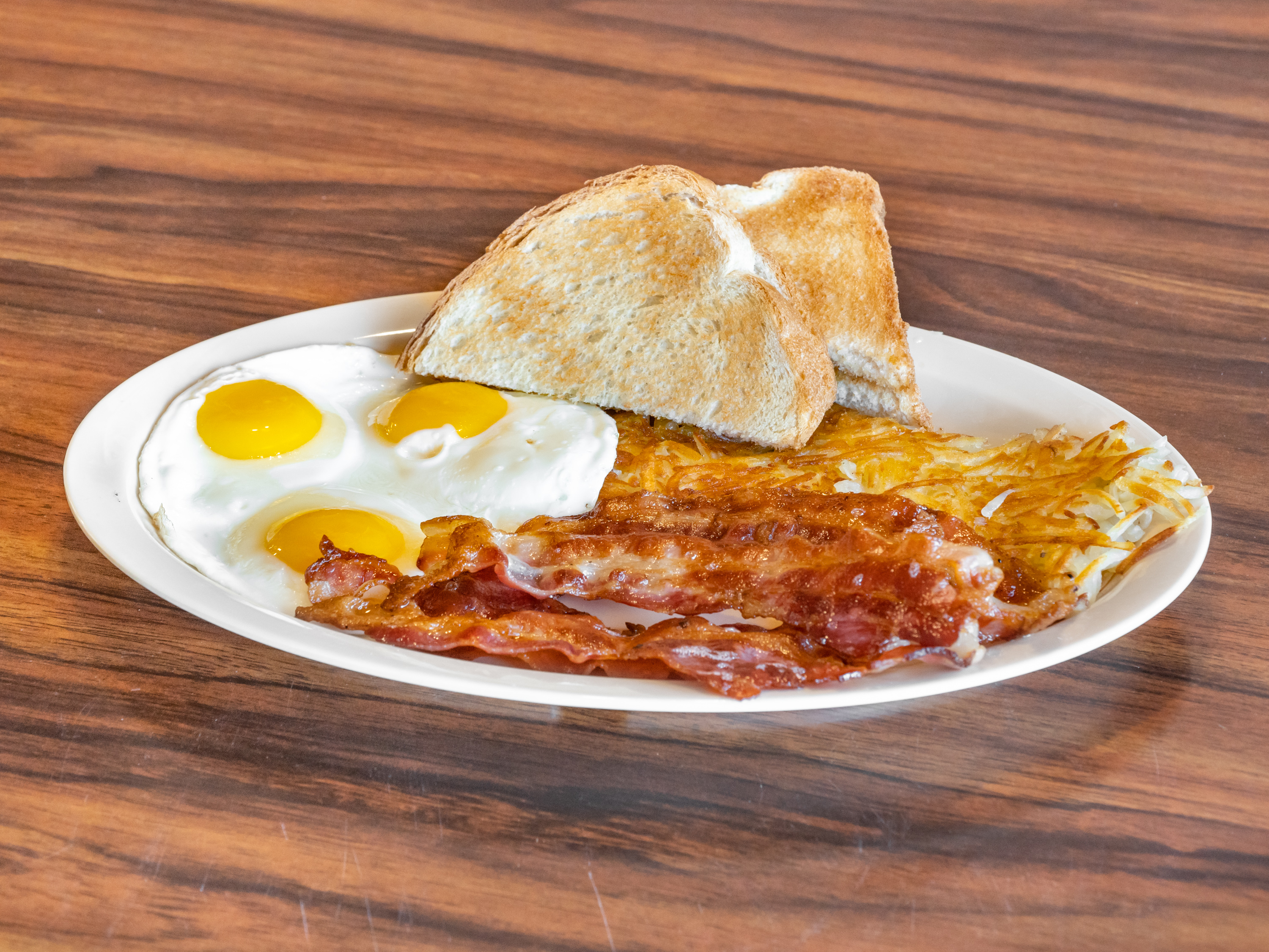 Order 2. Four Pieces Bacon, 3 Eggs Breakfast food online from Golden Burger store, Long Beach on bringmethat.com