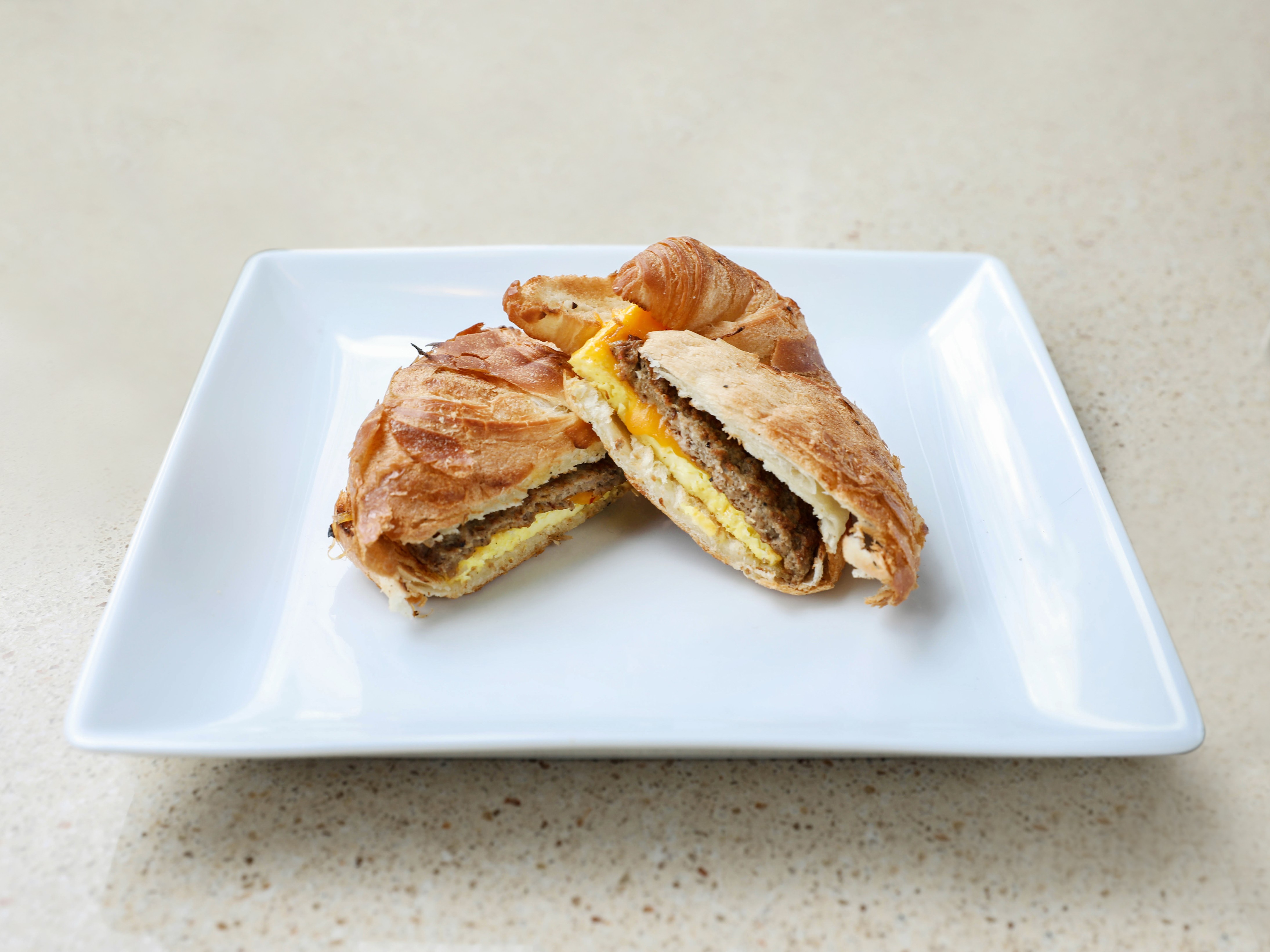 Order Sausage, Egg and Cheese Sandwich Breakfast food online from Tastefully Roasted Coffee store, Oakwood on bringmethat.com