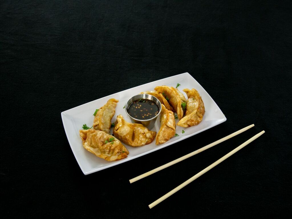 Order 12. Steamed Dumplings food online from China Dragon store, Nashville on bringmethat.com