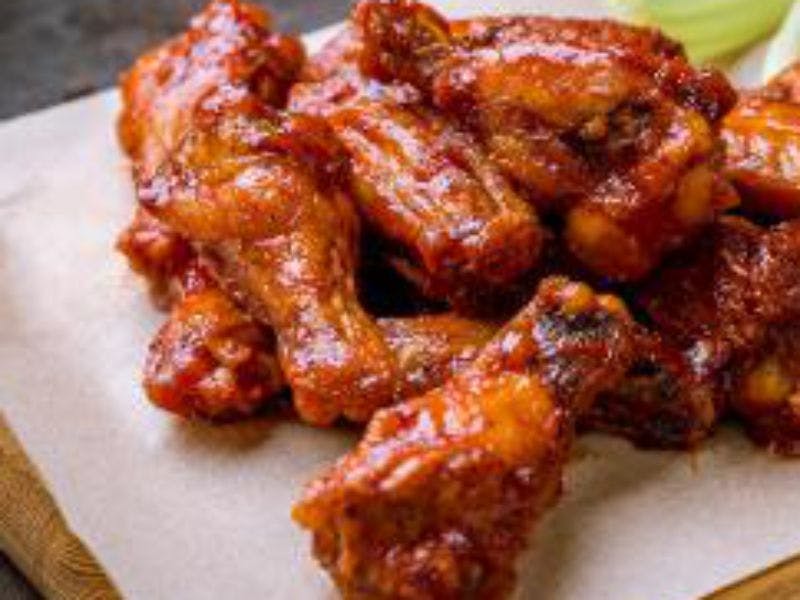Order Bone In Wings - 4 Pieces food online from American Classic Pizzaria store, Billings on bringmethat.com
