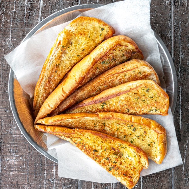 Order Garlic Bread (6 pieces) food online from Buffalo Cafe store, Rome on bringmethat.com