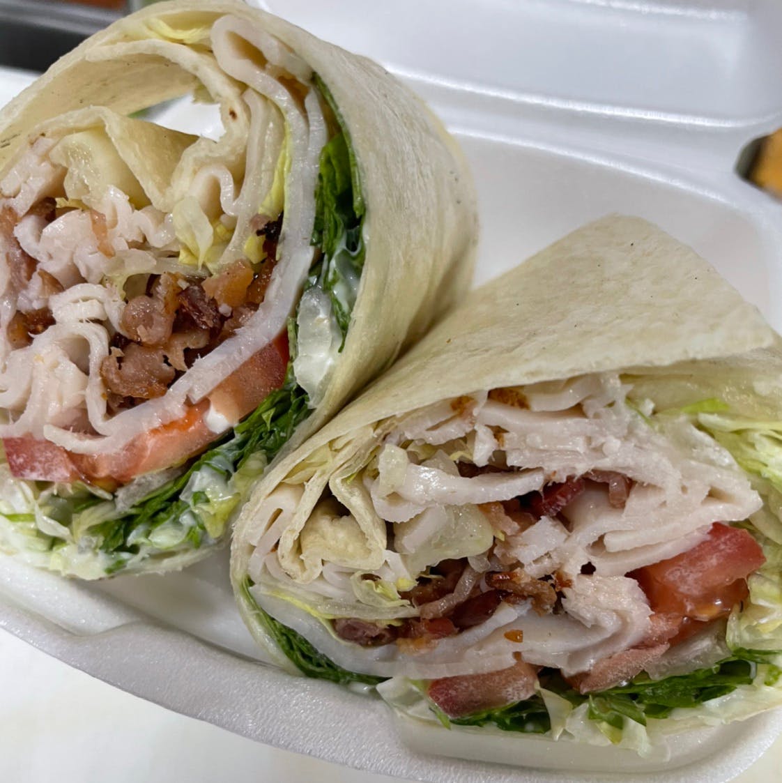 Order 10. Turkey BLT Wrap - Wrap food online from Davila's Pizza & Restaurant store, Hackettstown on bringmethat.com