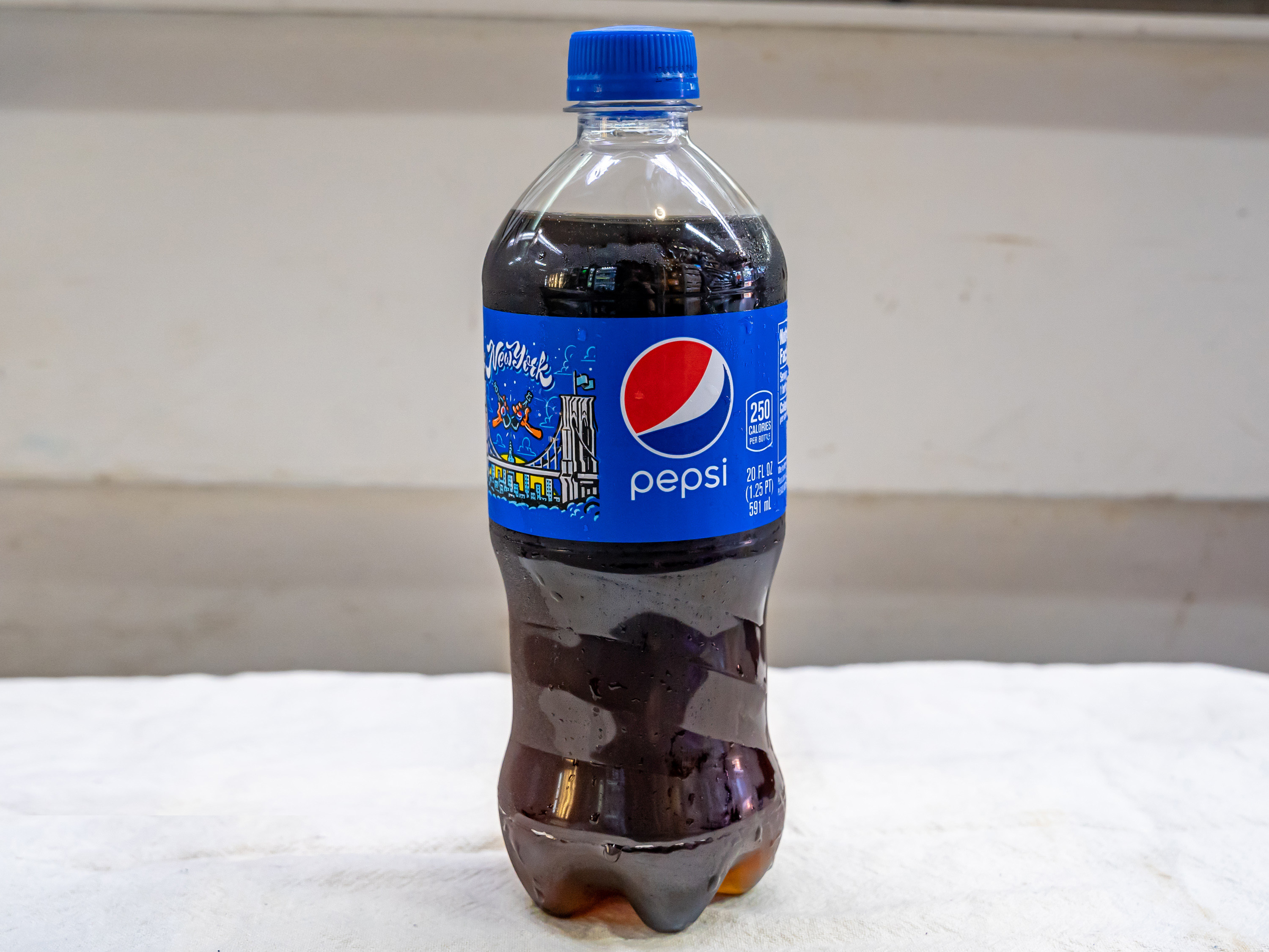 Order Pepsi - 20oz bottle food online from Quentin Deli and Grocery store, Brooklyn on bringmethat.com