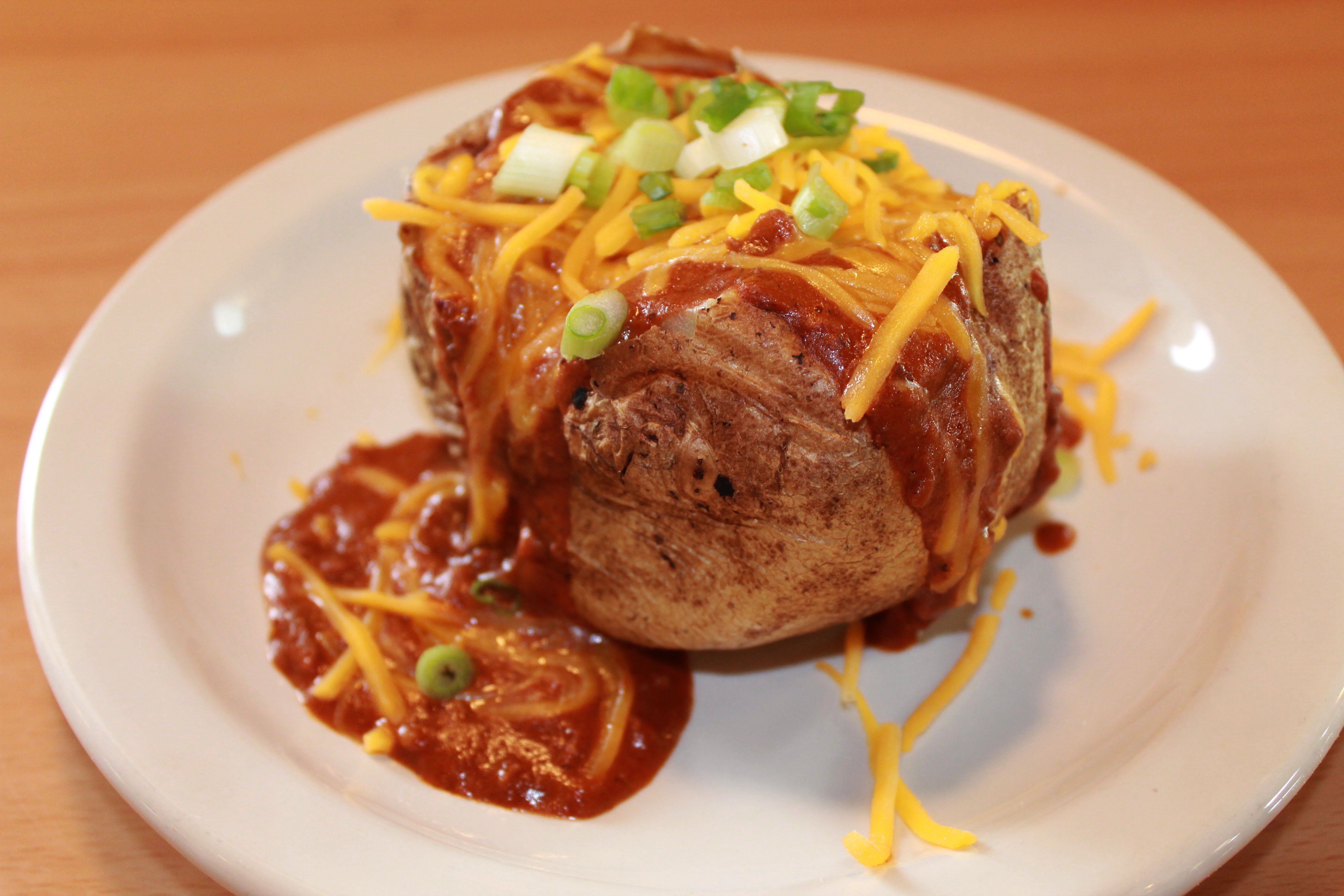 Order Chili Cheese Spud  food online from Pecan St. Station Deli And Grill store, Pflugerville on bringmethat.com