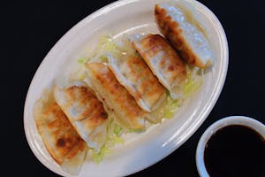 Order Chicken Dumplings-Pan fried 锅贴 food online from Shangri-La Restaurant store, Colorado Springs on bringmethat.com