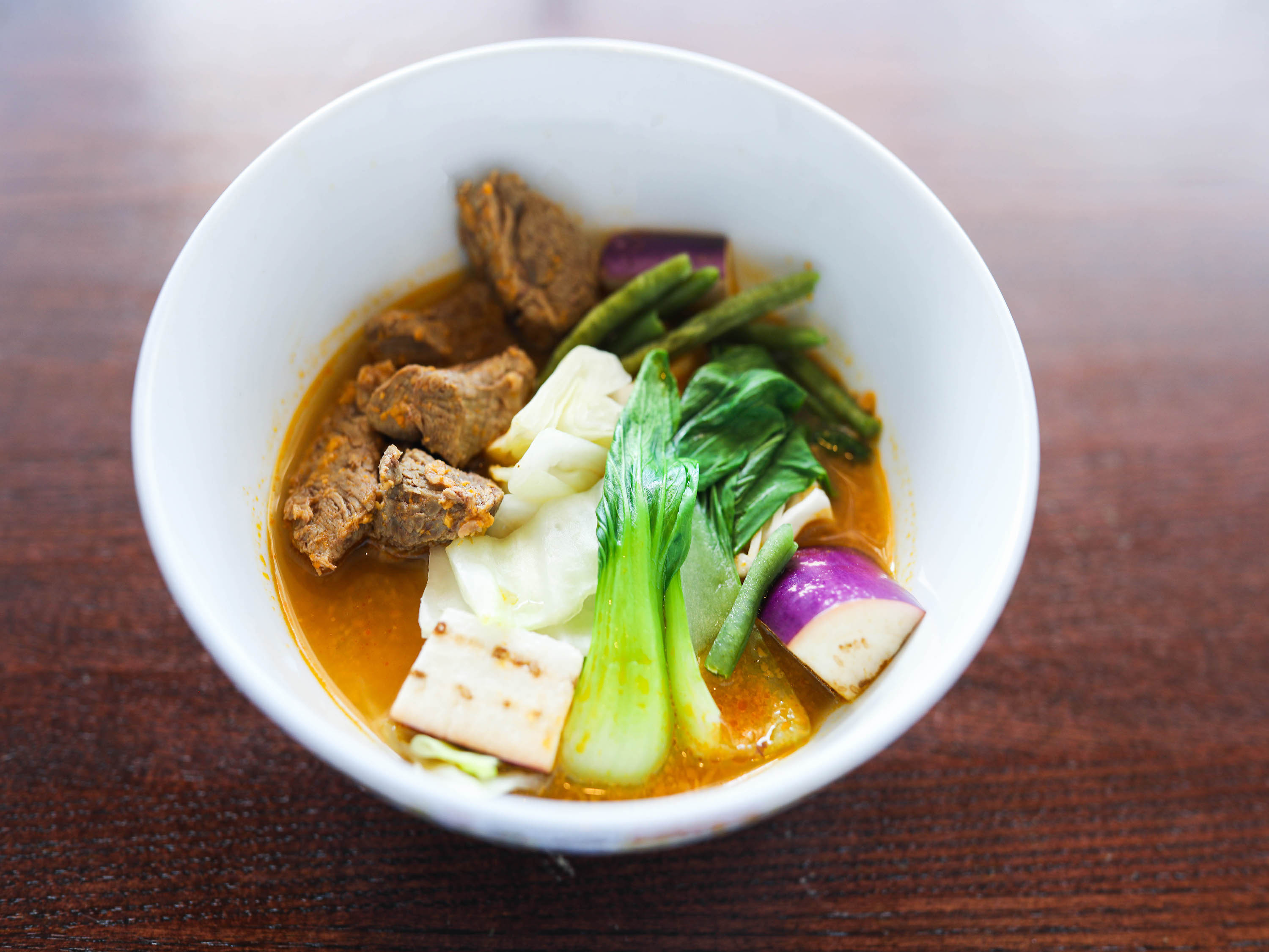 Order Kare Kare Stew food online from Mateo Kitchen & Catering store, Sergeant Bluff on bringmethat.com