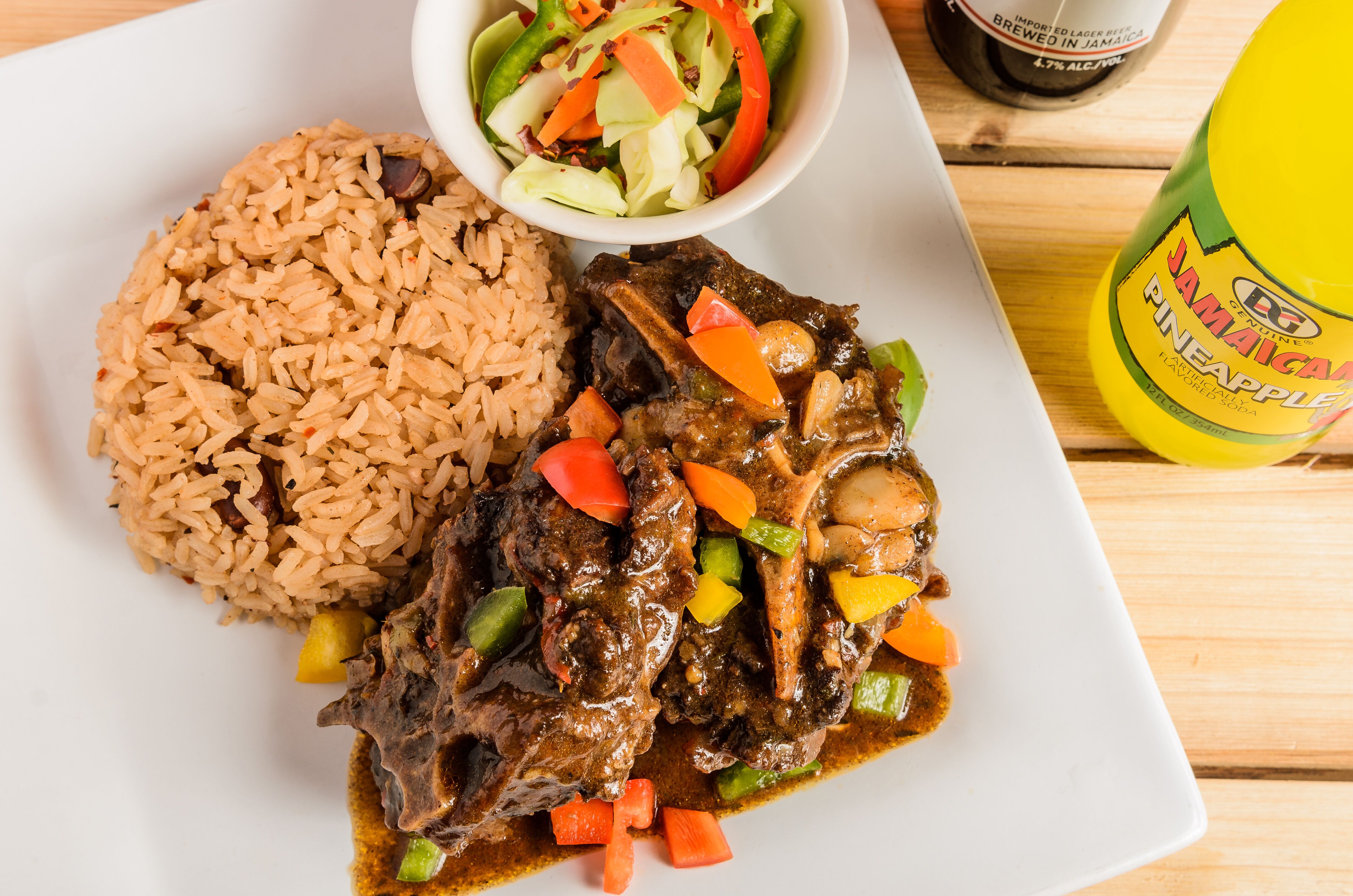 Order Oxtails stew food online from Di Jerk Stop store, Lafayette on bringmethat.com