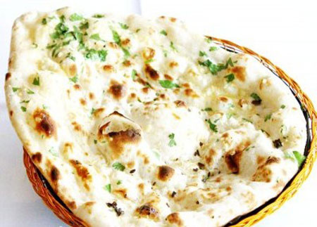 Order Garlic Naan food online from Taj Mahal Indian Restaurant store, Dallas on bringmethat.com