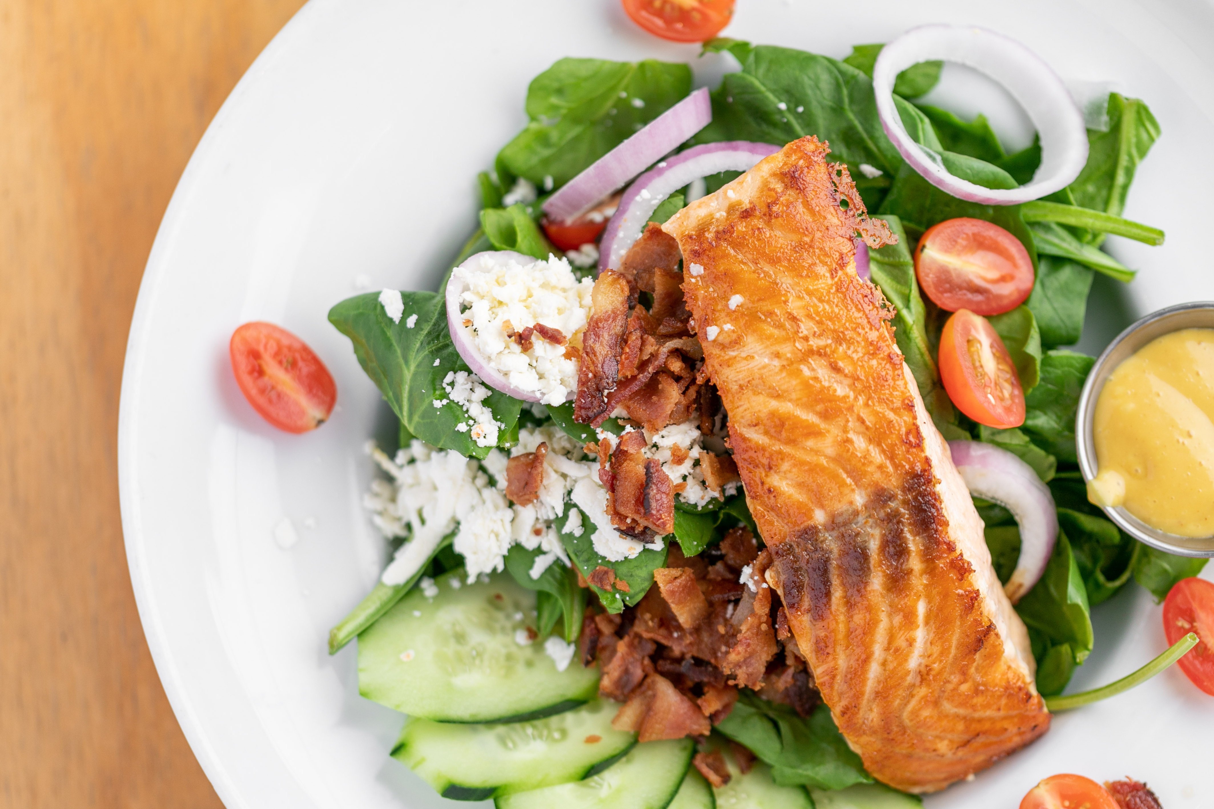 Order Spinach Salmon Salad* food online from Swami Cafe store, San Diego on bringmethat.com