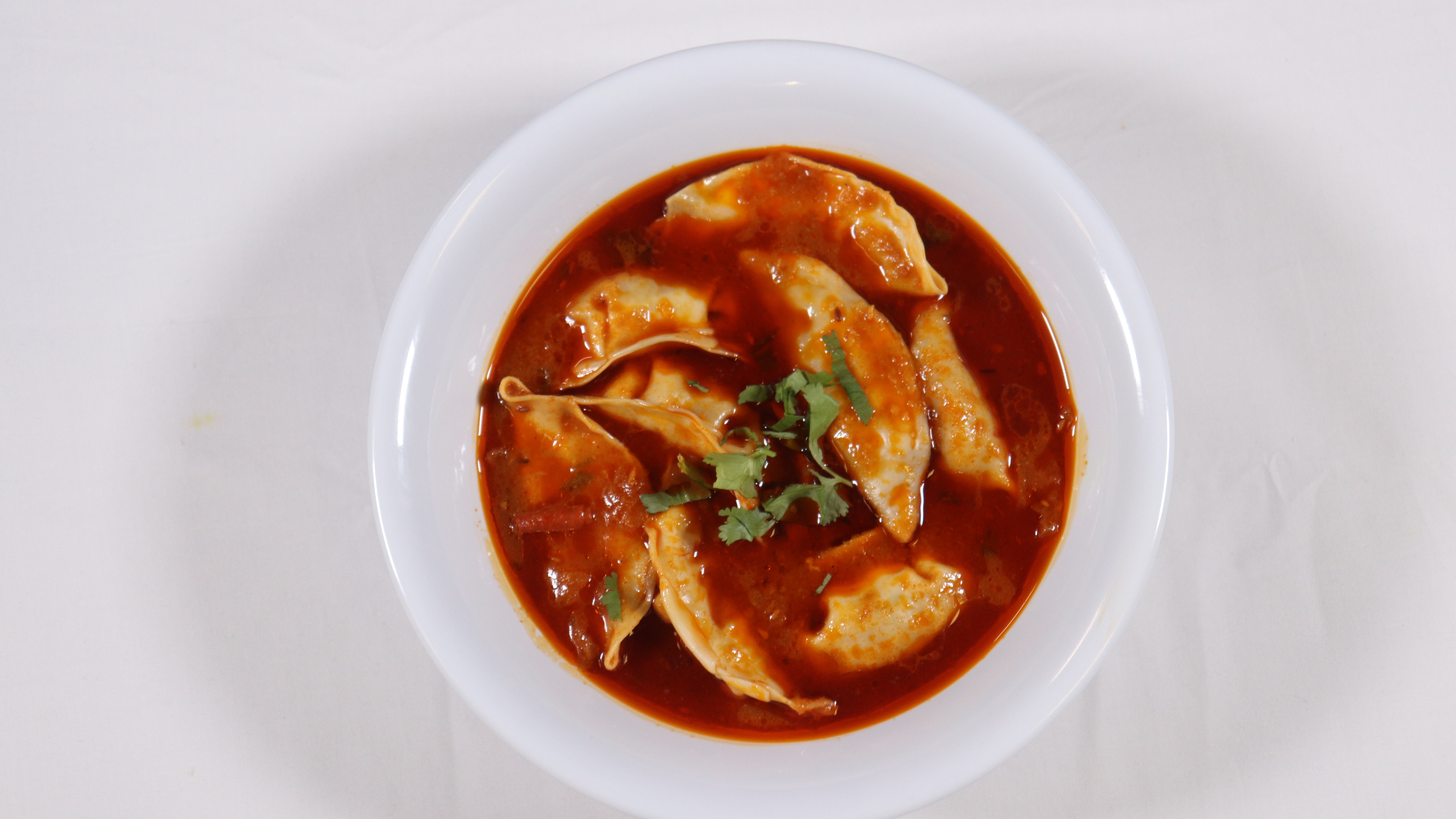 Order Buff Jhol Momo food online from Hot N Spicy Restaurant store, Irving on bringmethat.com
