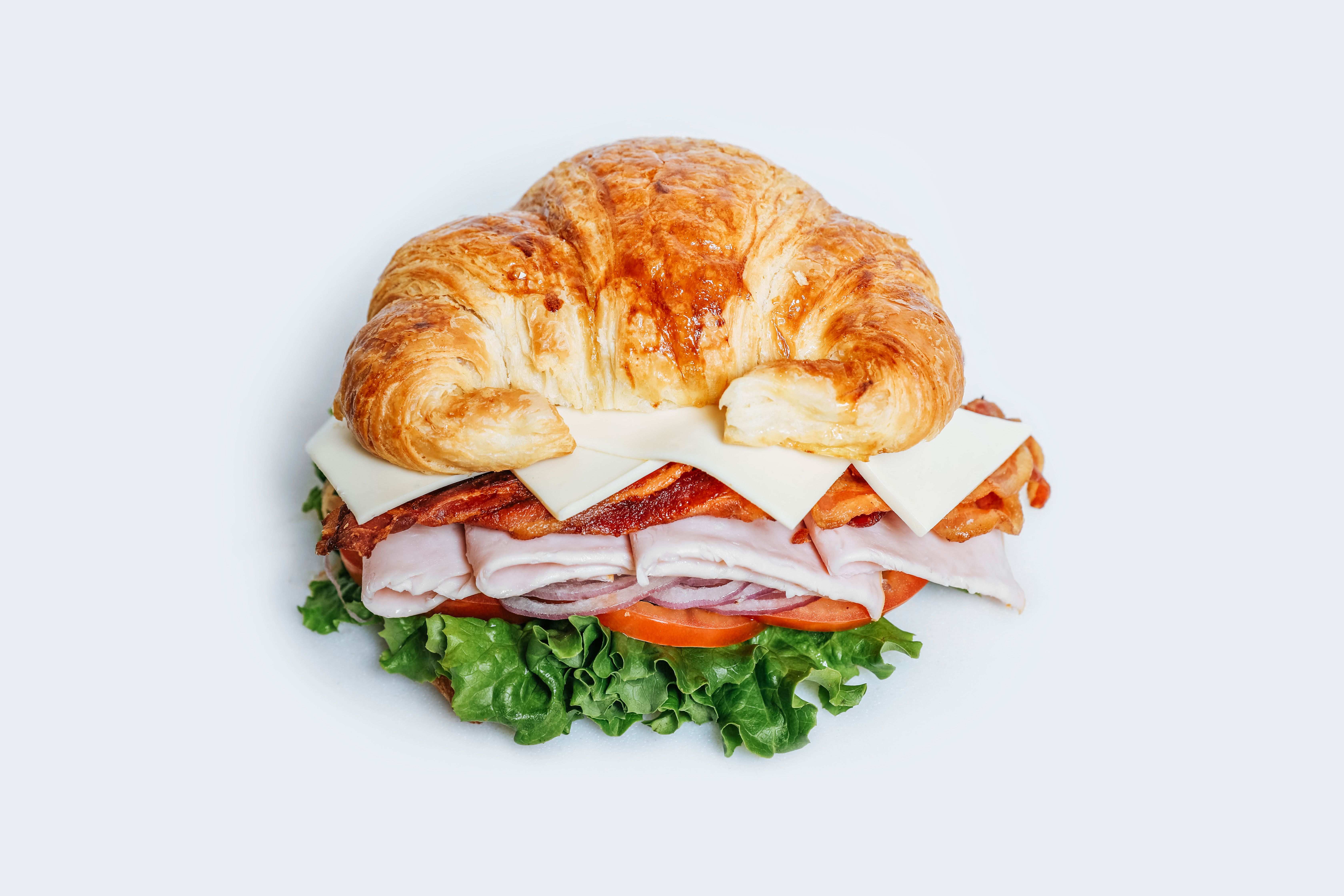 Order #9 Turkey Club Croissant Lunch food online from Dc Donut Cafe store, Granada Hills on bringmethat.com