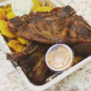 Order CHULETA/Pork Chops food online from Manny Mofongo store, Yonkers on bringmethat.com