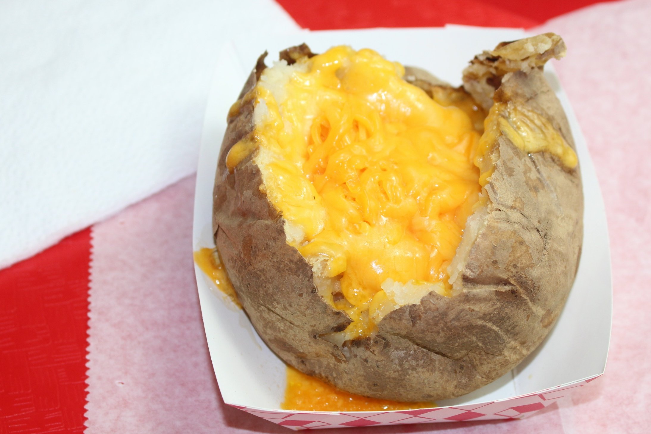 Order 7. Baked Potato with Cheddar Cheese, Butter food online from Reddi Chick BBQ store, Santa Monica on bringmethat.com