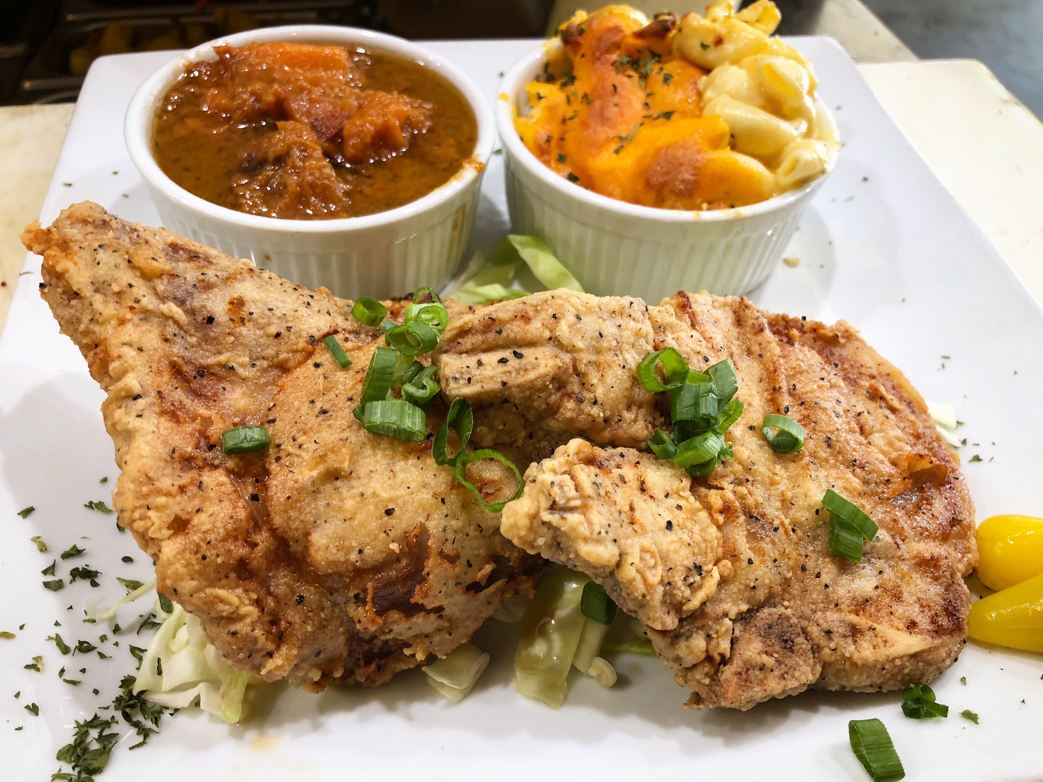 Order 2 Pieces Pork Chops food online from Stevie Creole Cafe store, Los Angeles on bringmethat.com