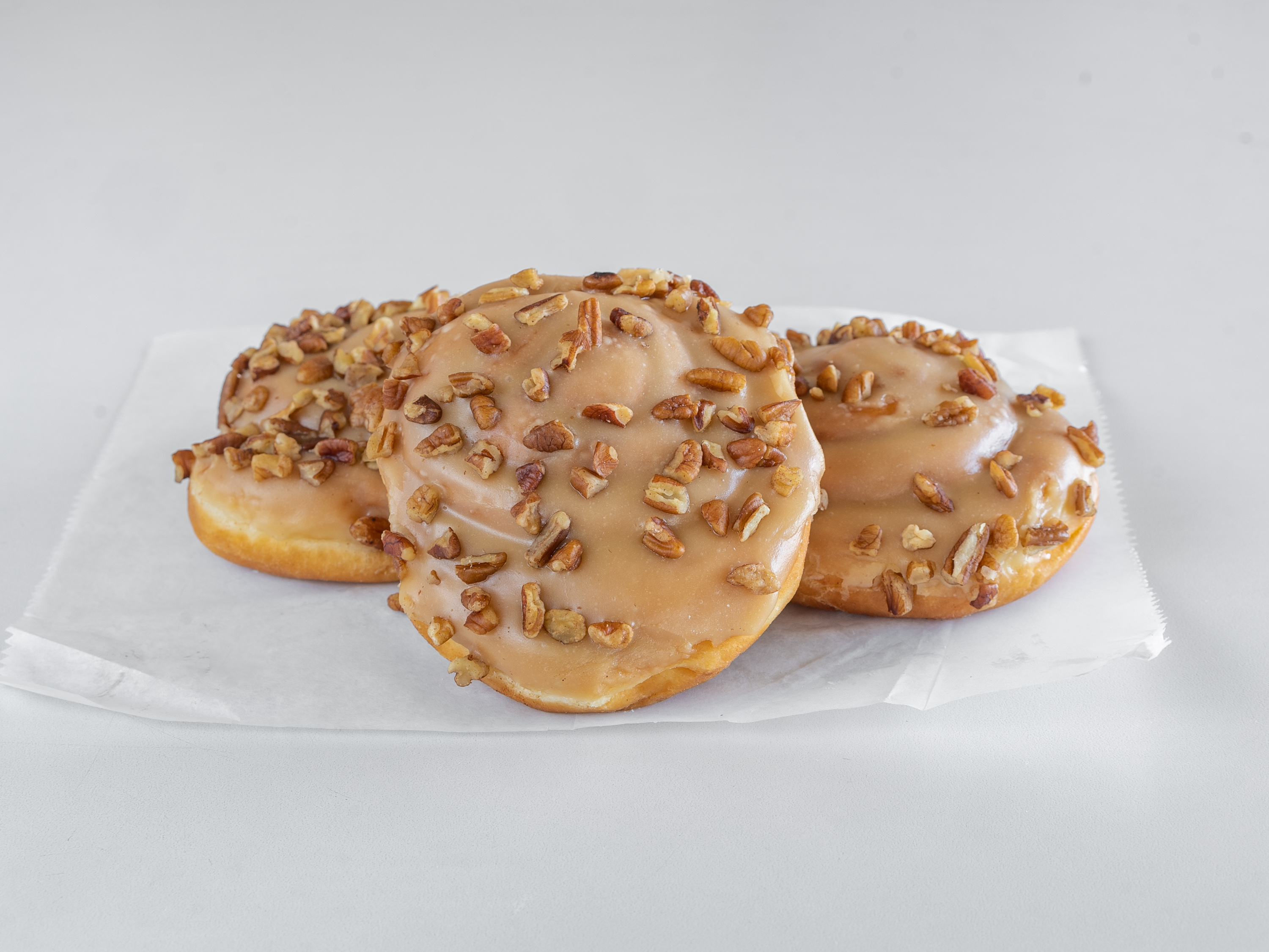 Order Maple Iced Pecan Roll food online from Mary Ann Donuts store, North Canton on bringmethat.com