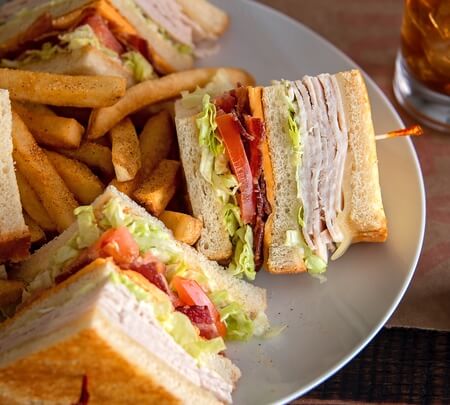 Order Turkey Club Sandwich food online from Shoneys Family Restaurant store, San Antonio on bringmethat.com