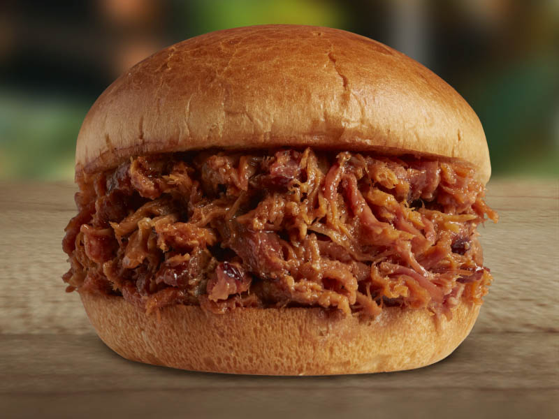 Order Pulled Pork BBQ with Tangy Western BBQ Sauce food online from Brookwood Farms Carolina Pit BBQ store, Charlotte on bringmethat.com